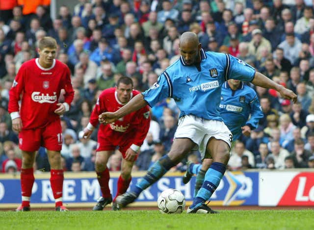 Nicolas Anelka, right, scores a penalty in City's most recent win at Anfield