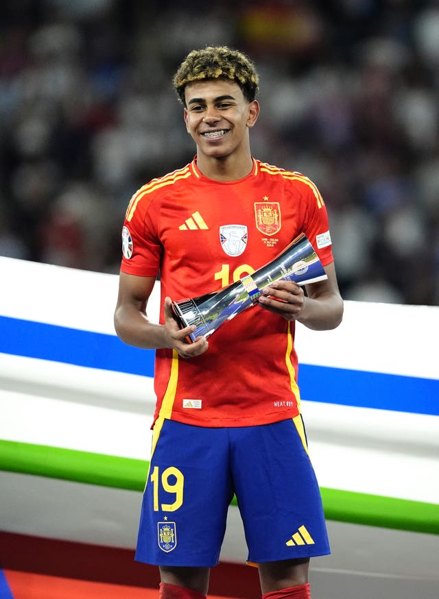 Spain’s Lamine Yamal with the Best Young Player of the Tournament trophy following victory against England after the UEFA Euro 2024 final match at the Olympiastadion, Berlin. 