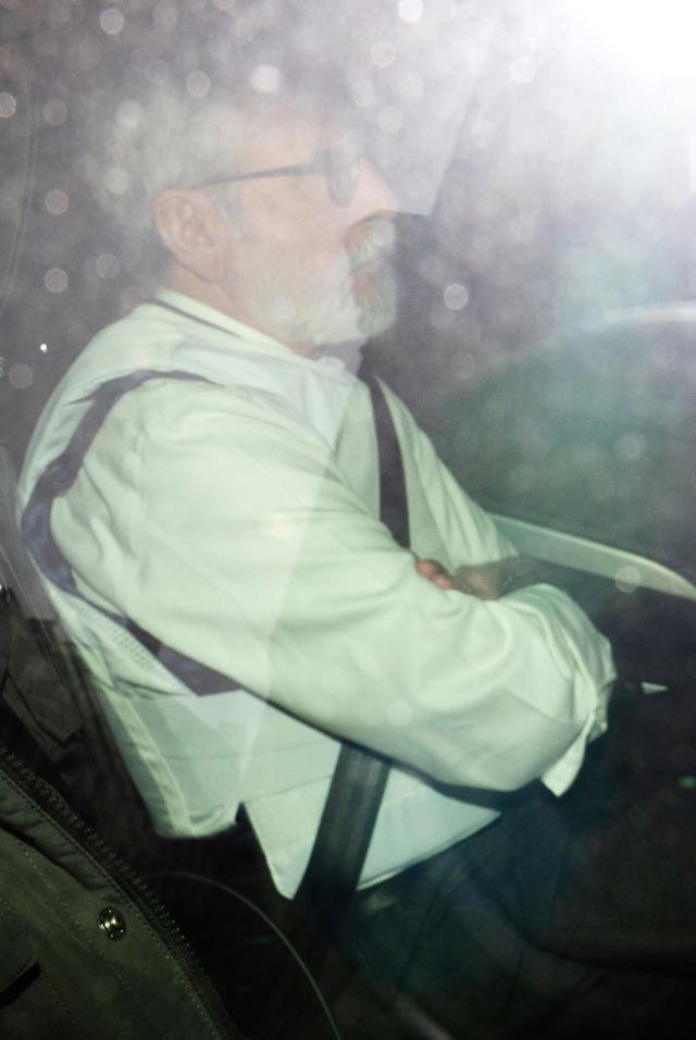 Gerry Adams wearing protective equipment as he arrives at the Royal Courts of Justice