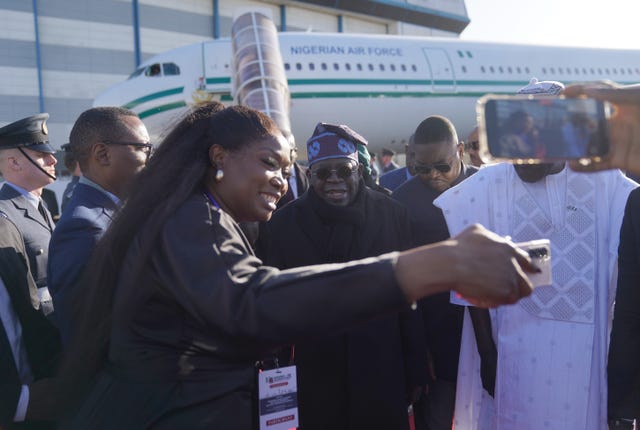President of Nigeria Bola Ahmed Tinubu is surrounded by media