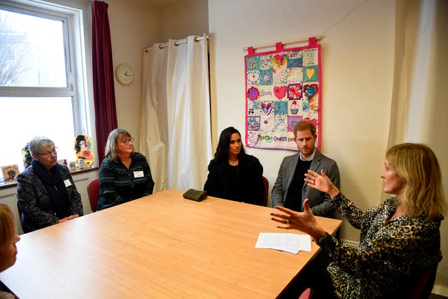 Meghan and Harry meet staff and volunteers during their visit to One25