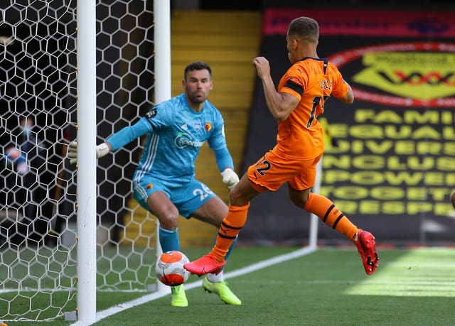 Newcastle’s Dwight Gayle scores the opening goal
