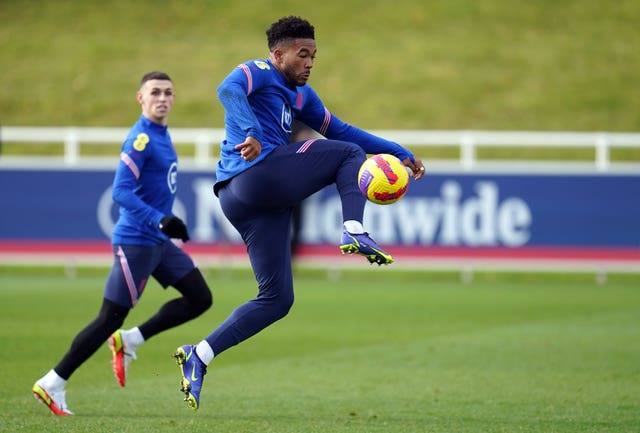 Reece James controls the ball ahead of Manchester City's Phil Foden in England training