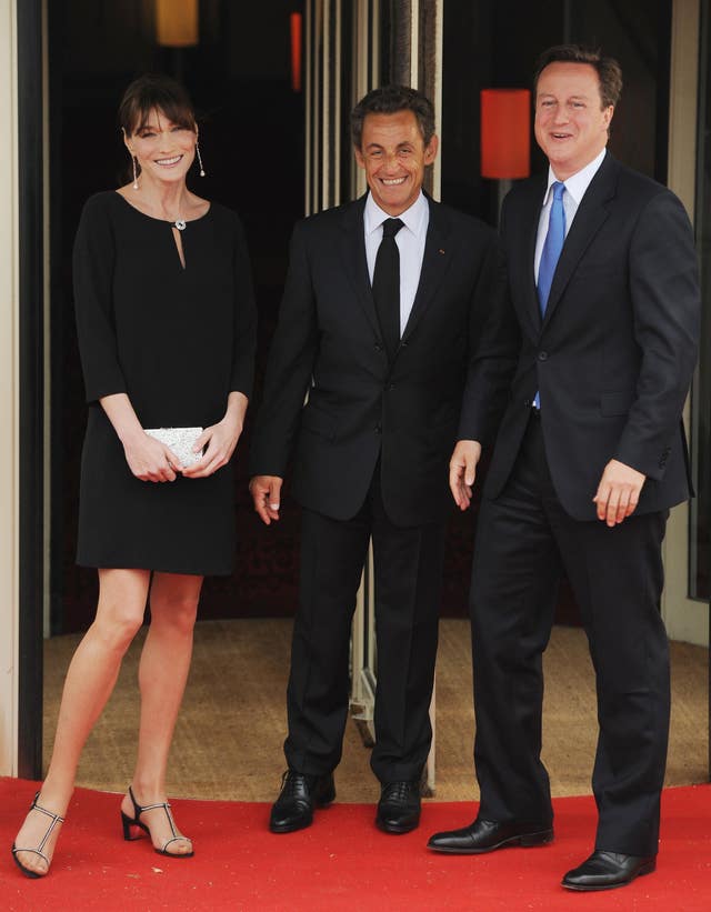 French President Nicolas Sarkozy and his wife Carla Bruni with former British Prime Minister David Cameron