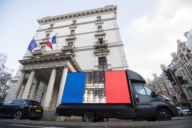 A Grenfell United campaign billboard outside the French embassy in London