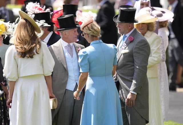 The King speaks with Zara Tindall and Mike Tindall at Royal Ascot 