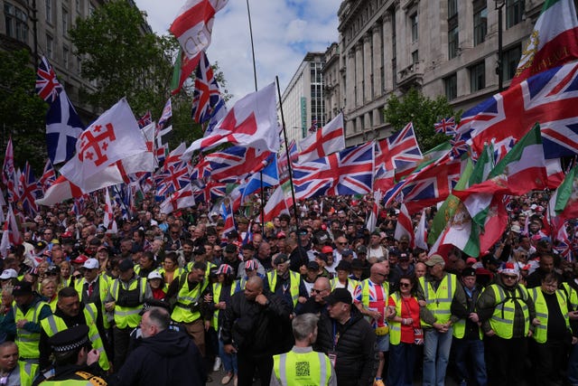 People taking part in Tommy Robinson&rsquo;s Unite the Kingdom march in central London