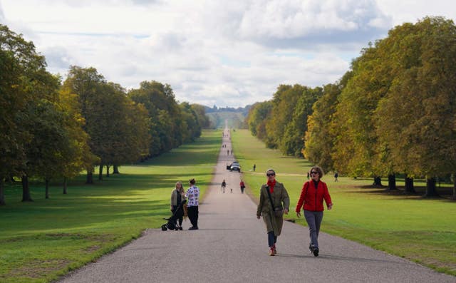 Visitors to Windsor Great Park make their way up the Long Walk towards Windsor Castle