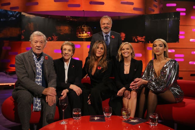 Host Graham Norton with (seated left to right) Sir Ian McKellen, Dame Julie Andrews, Jennifer Aniston, Reese Witherspoon and Dua Lipa 