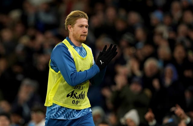 Kevin De Bruyne warming up on his return to the Man City squad (Martin Rickett/PA)