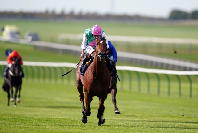 Nostrum ridden by Ryan Moore on their way to victory in the Tattersalls Stakes at Newmarket