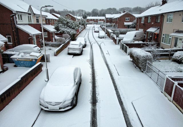 Snow-covered vehicles in Liverpool