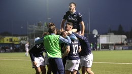 Dundee players celebrate their fifth goal (Steve Welsh/PA)