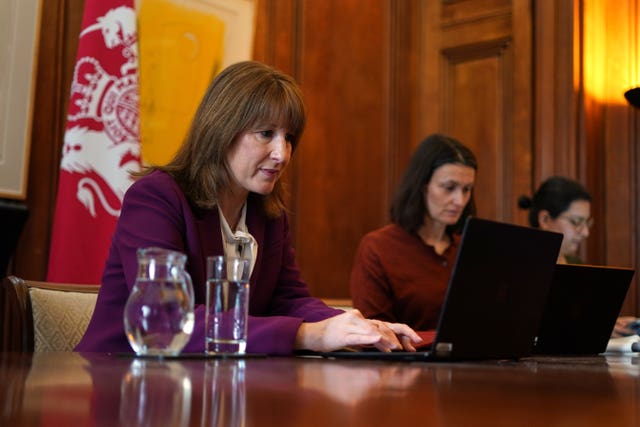 Rachel Reeves sitting down at a desk at 11 Downing Street in a meeting with other world finance ministers through a laptop