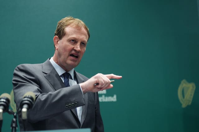 Jim O'Callaghan pointing while speaking from an Irish Government lectern