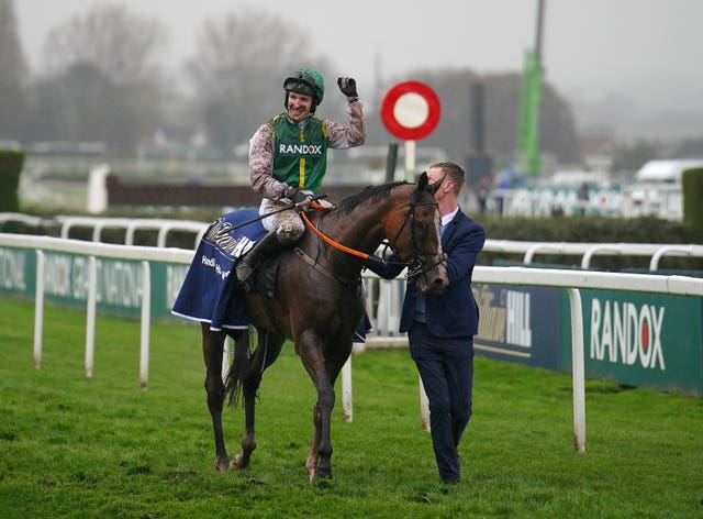 Ben Harvey celebrates winning the William Hill Handicap Hurdle on Fennor Cross