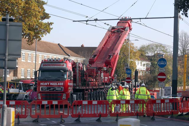 A crane is raised into position at the scene near the tram crash in Croydon, Surrey, in 2016 