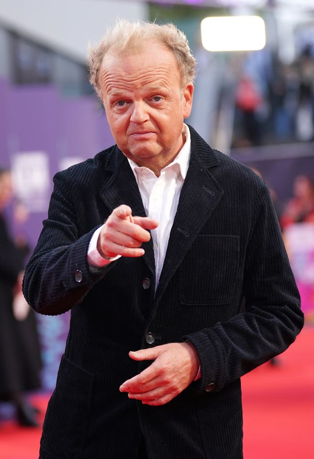 Toby Jones points at the camera