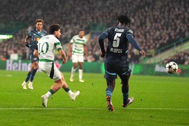 Celtic’s Nicolas Kuhn, left, scores his side’s equaliser in the win over RB Leipzig