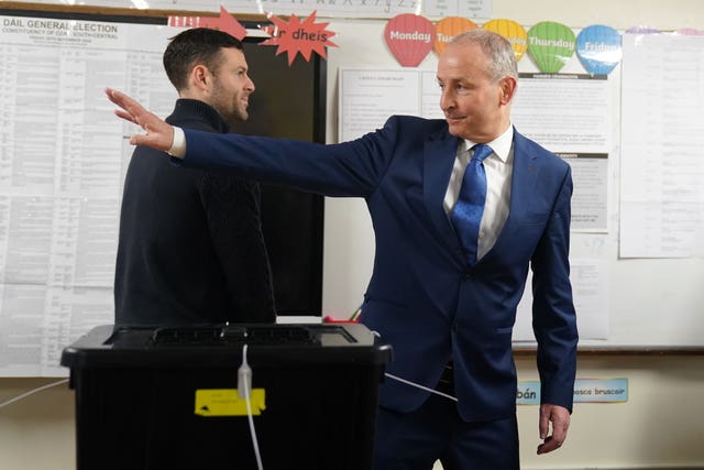 Tanaiste and Fianna Fail leader Micheal Martin, accompanied by his family, casts his vote at St Anthony’s Boys’ School, Beechwood Park, Ballinlough, Cork