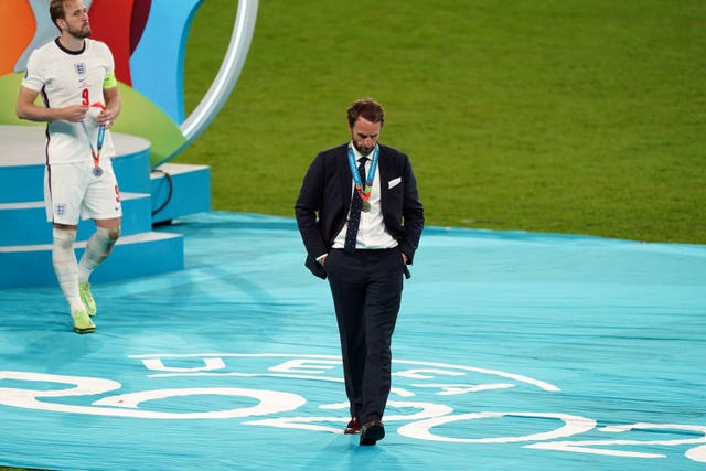 England manager Gareth Southgate and Harry Kane leave the presentation podium disappointed 