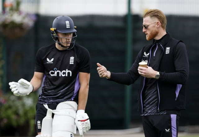 Ben Stokes (right) passes on some advice to Matthew Potts (left) at England's net session.