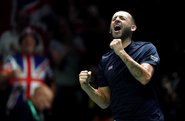 Dan Evans celebrates beating Arthur Fils during the Davis Cup group stage match against France in Manchester (Martin Rickett/PA)