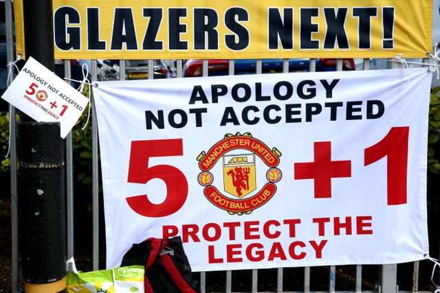 Banners near the stadium as fans protest against the Glazer family