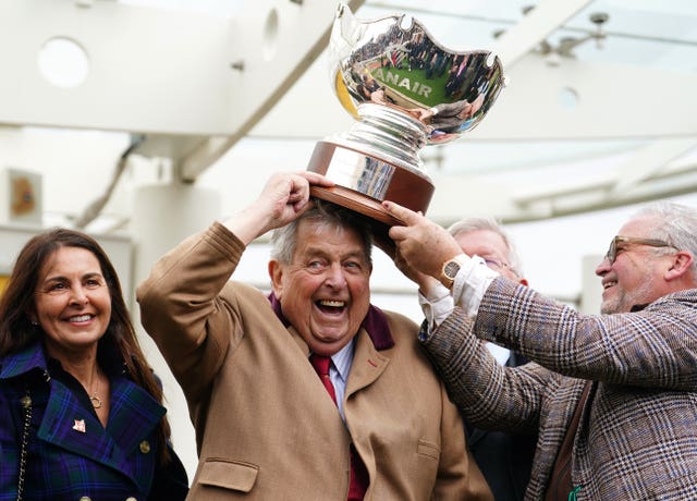 Part owner John Hales (centre) celebrates with the Ryanair Chase trophy