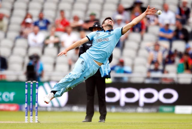 Mark Wood dives for the ball at Old Trafford
