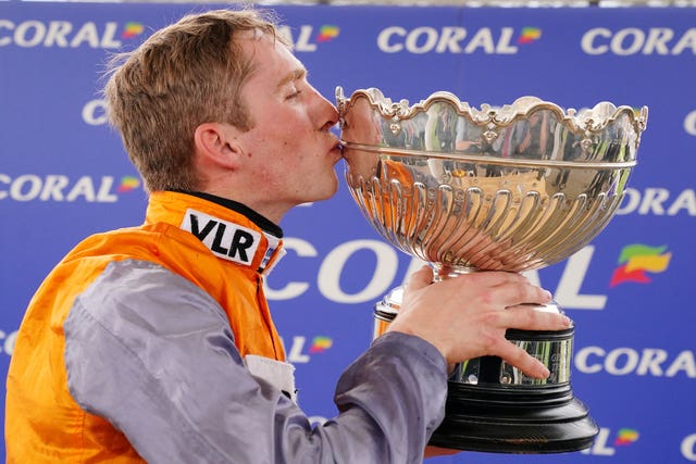 A big kiss for the trophy from Harry Cobden