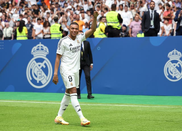 Kylian Mbappe waves at his Real Madrid unveiling