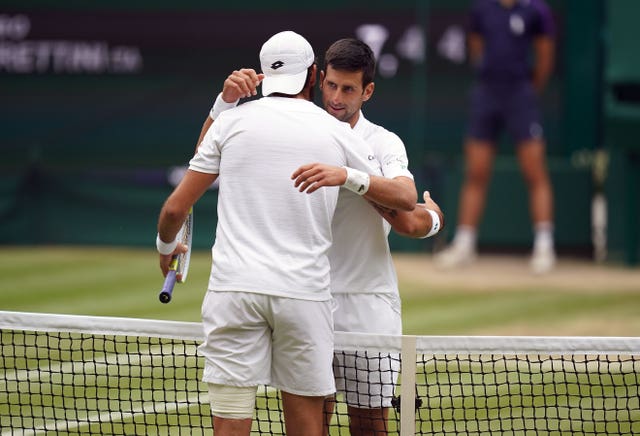 Novak Djokovic and Matteo Berrettini embrace