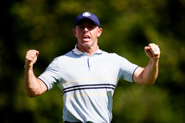 Rory McIlroy celebrates victory in his first match at the Ryder Cup