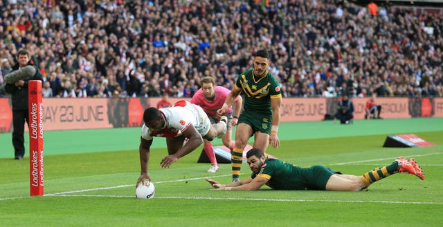 Jermaine McGillvary (left) scores a try against Australia