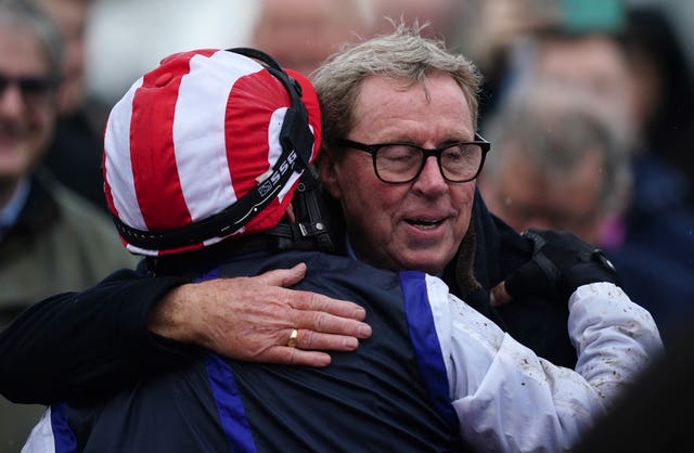 Jockey Ben Jones celebrates with winning owner Harry Redknapp after winning at Cheltenham