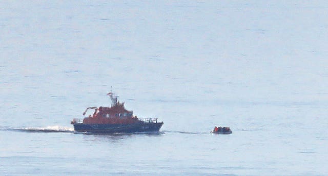 A lifeboat approaches a small craft thought to be carrying migrants off the Kent coast near Dover