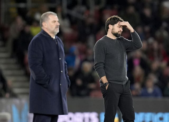 Southampton manager Russell Martin (right) holds his head during the Premier League match with Tottenham