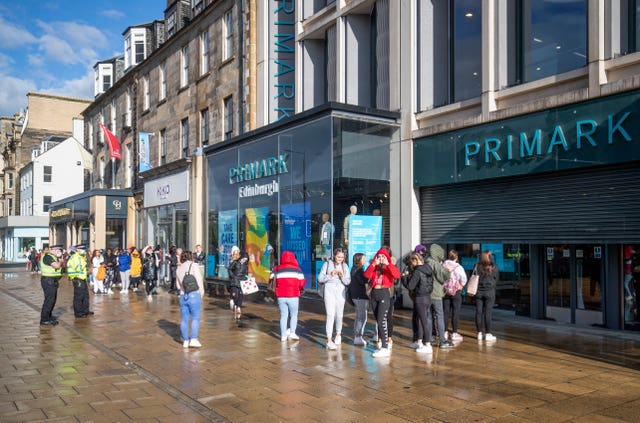 People queue outside a Primark store