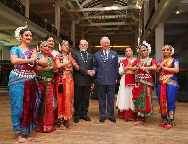 The visitors pose with dancers at the Science Museum (Hannah McKay/PA)