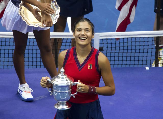 Emma Raducanu poses with the trophy after winning the women’s singles final on day twelve of the US Open