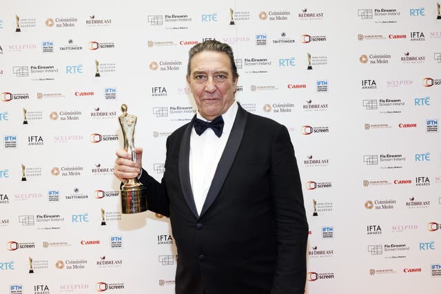 Ciaran Hinds with an award