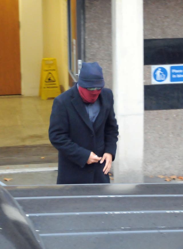 Jamien Nagadhana, 31, covered his face as he left Walsall Magistrates’ Court, West Midlands (Matthew Cooper/PA)