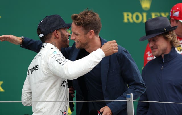 Lewis Hamilton is congratulated at the 2017 British Grand Prix by Jenson Button