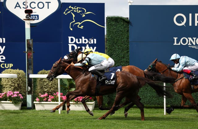 Perotto wins the Dubai Duty Free Shergar Cup Mile