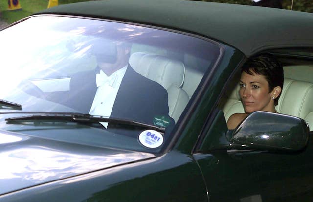The Duke of York drives with Ghislaine Maxwell in the passenger seat