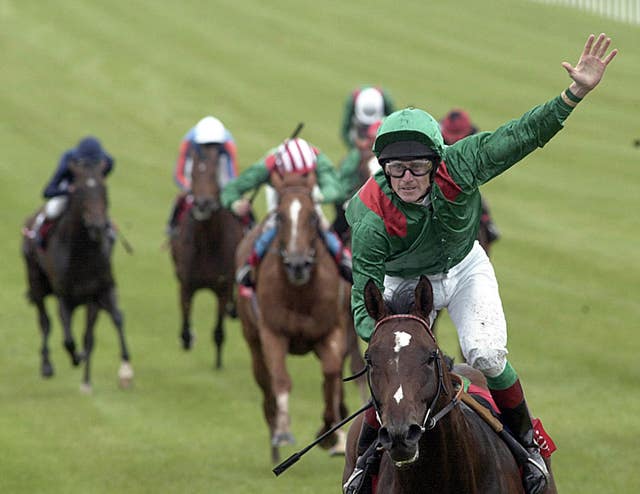 Johnny Murtagh salutes the crowd after winning the Irish Derby on Sinndar