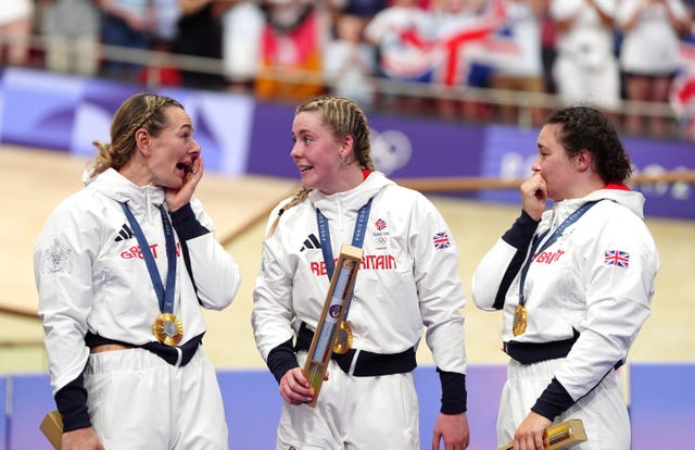 Katy Marchant, Emma Finucane and Sophie Capewell celebrate winning the women's team sprint at the Paris Olympics