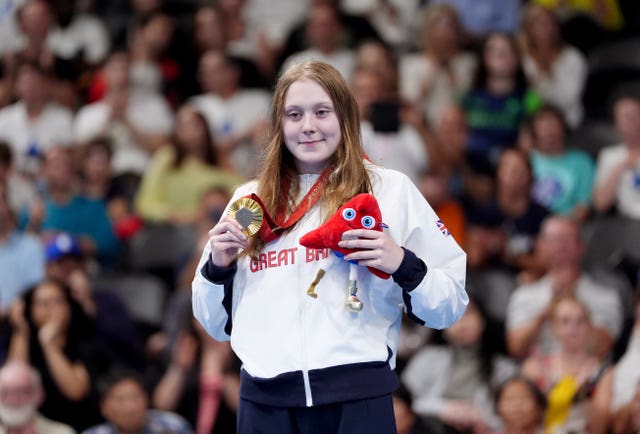 Great Britain’s Poppy Maskill with the gold medal after the women’s 100m backstroke S14 final