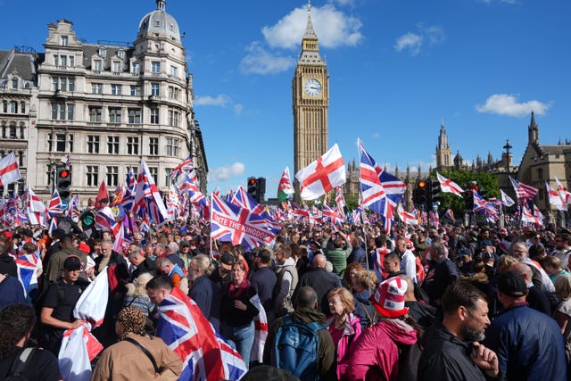 People taking part in the Tommy Robinson-led Unite the Kingdom march and rally in Parliament Square, central London in September 2025 (Lucy North/PA)